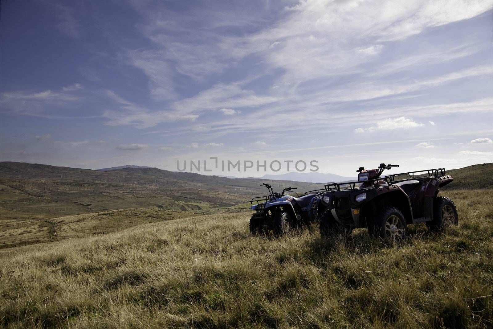 Pair of ATV quad bikes on lonely mountain by steheap