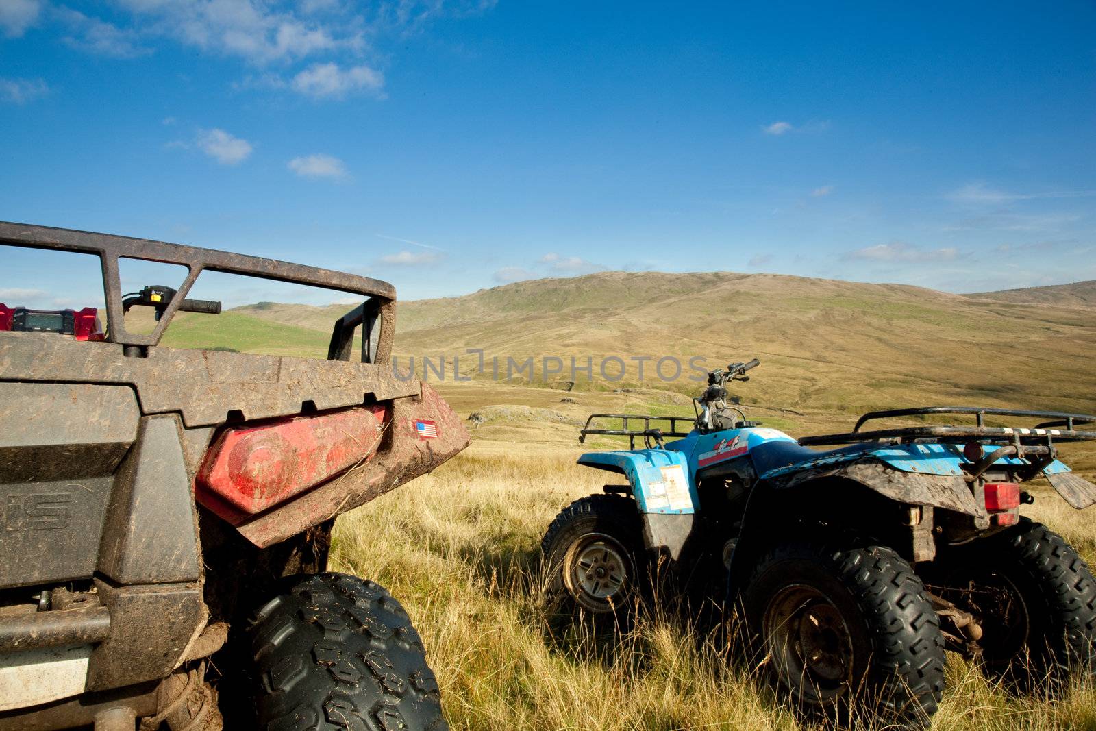 Off road quad bikes on mountainside in remote Welsh valley