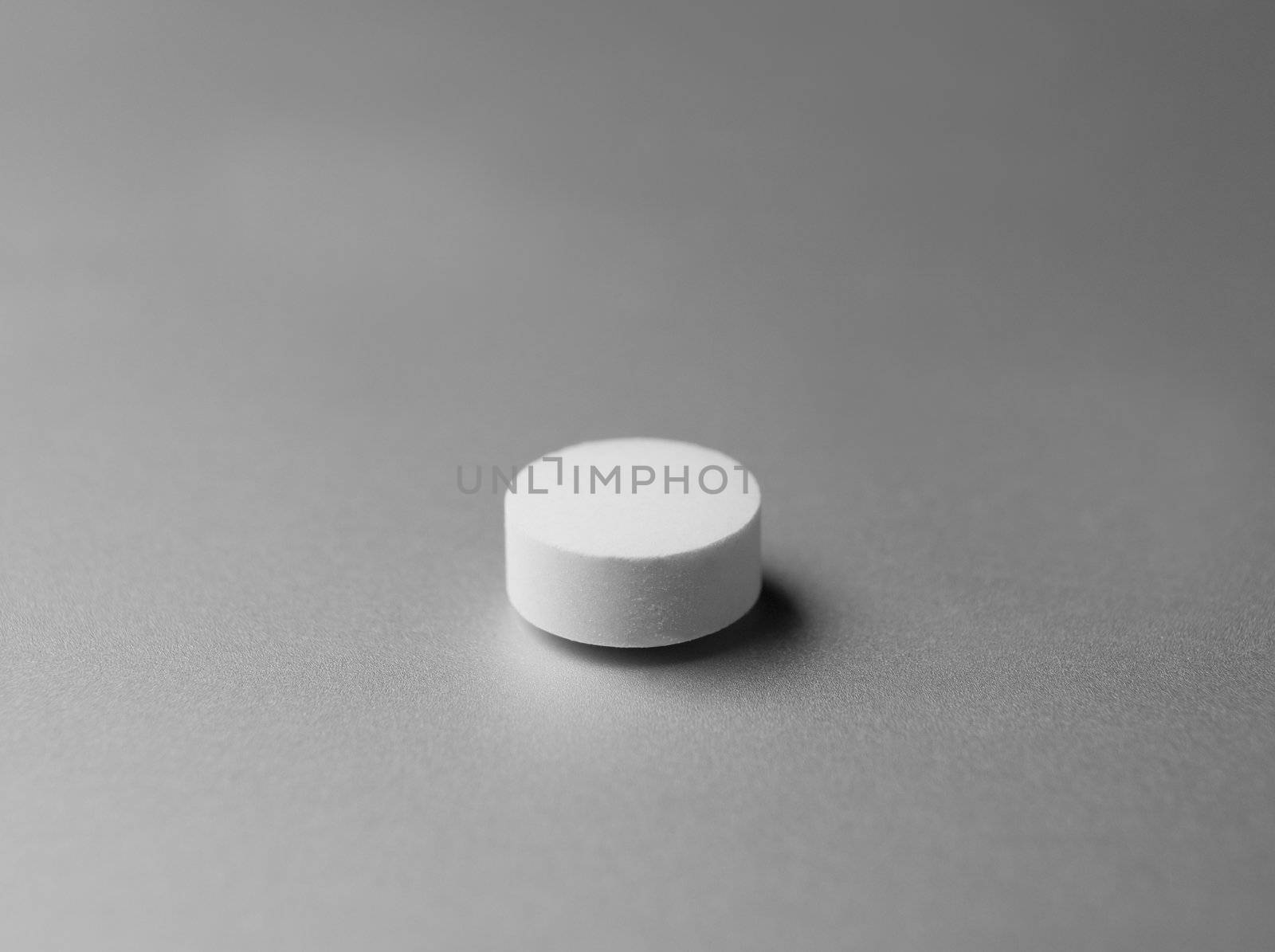 Pill at silver background