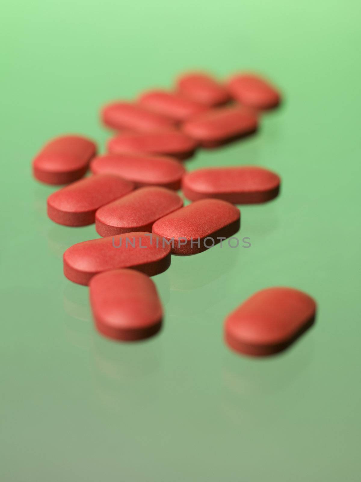 Red pills toward green background
