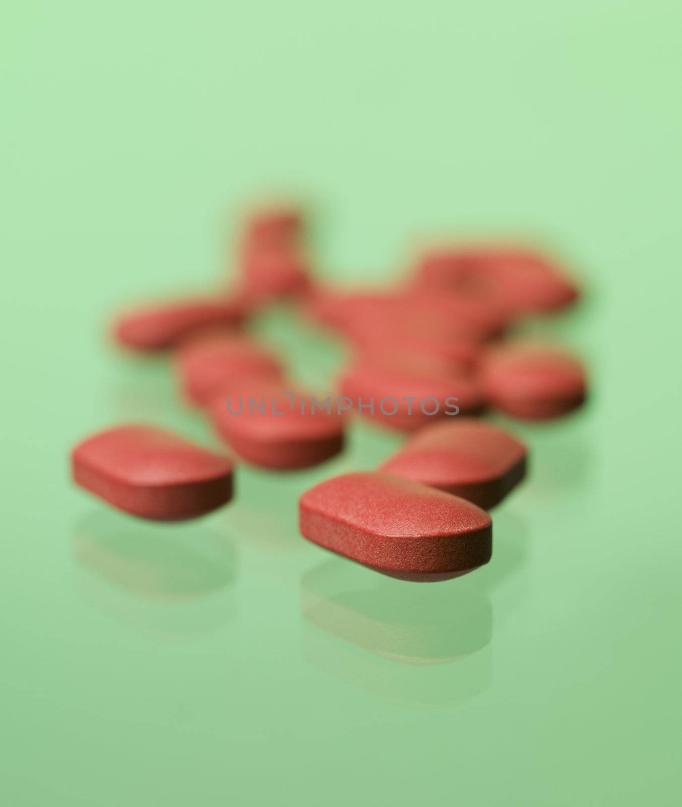 Red pills toward green background by gemenacom