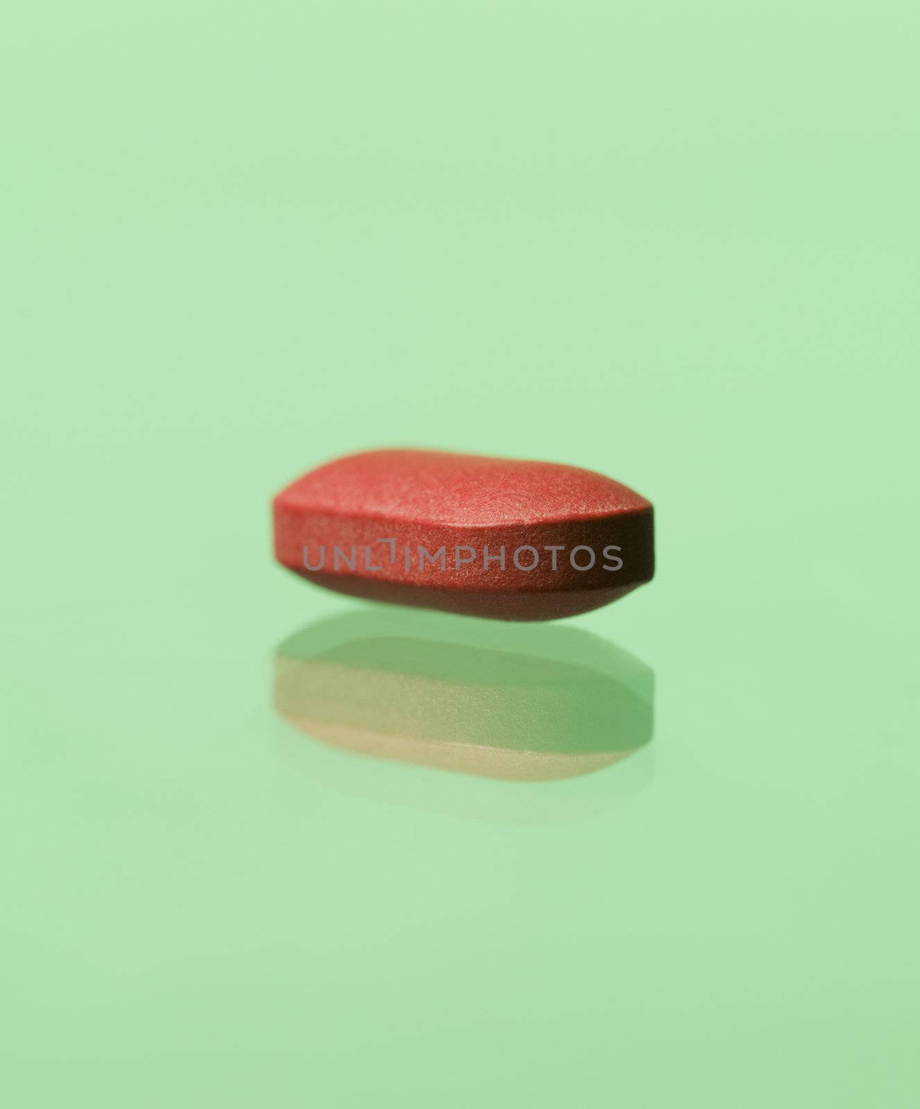 red pill toward green background