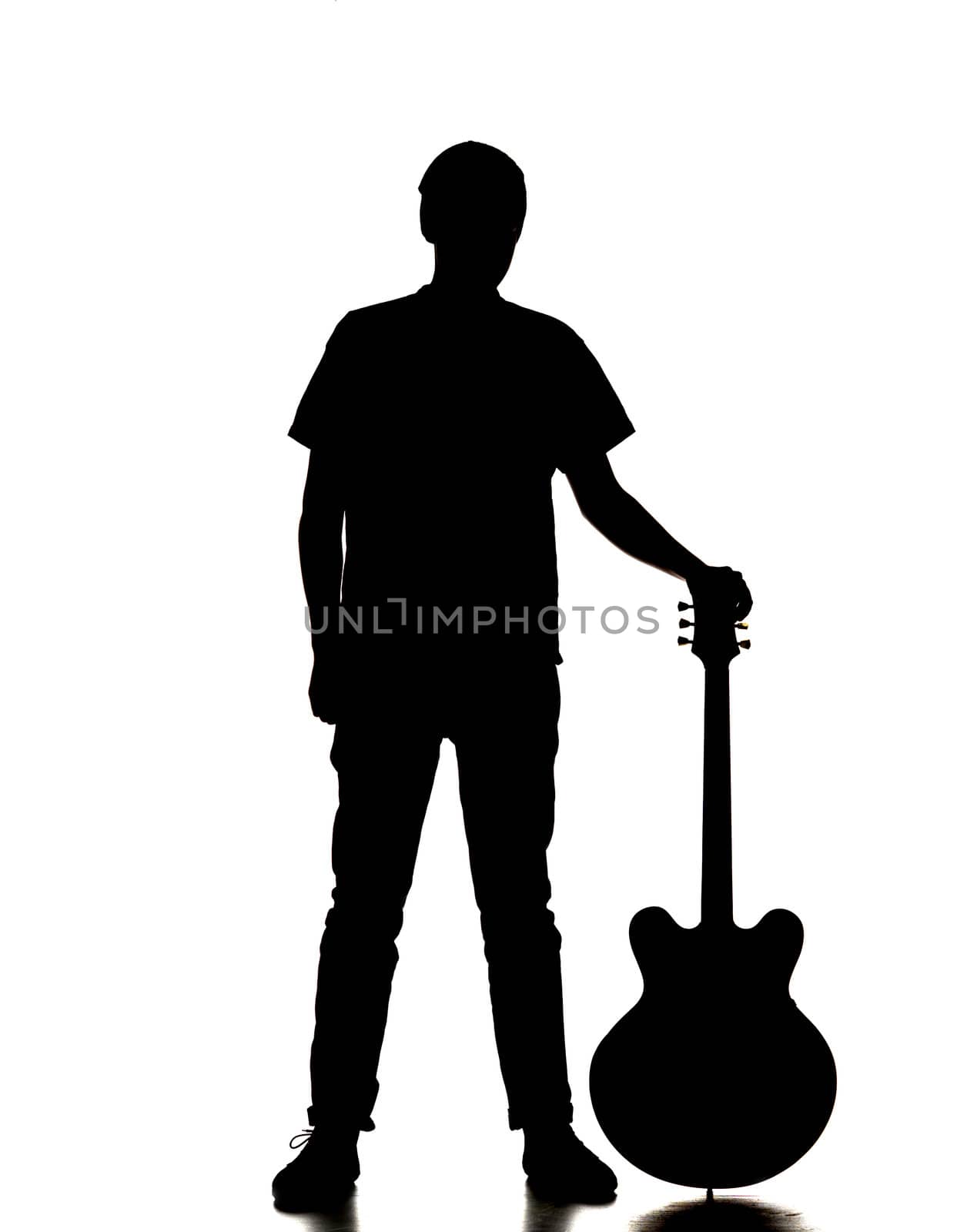 silhouette of a man playing guitar