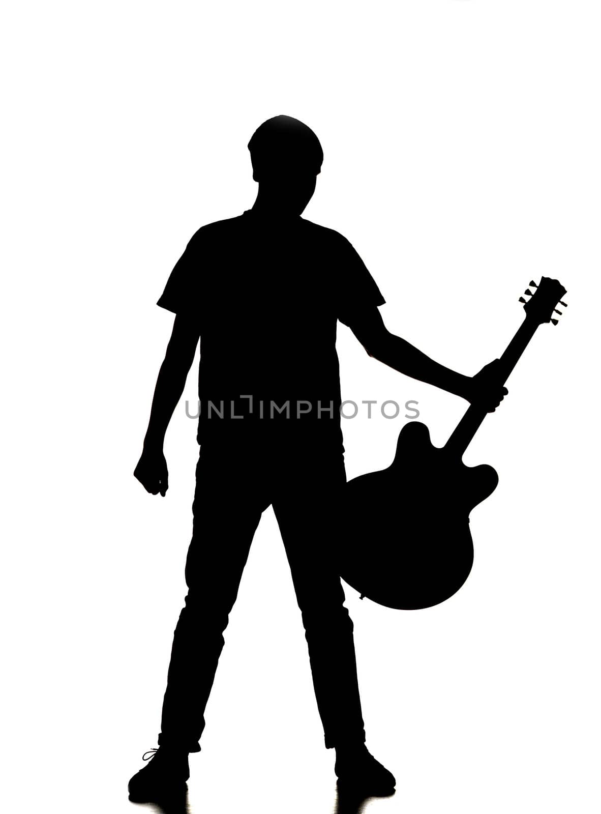 silhouette of a man playing guitar