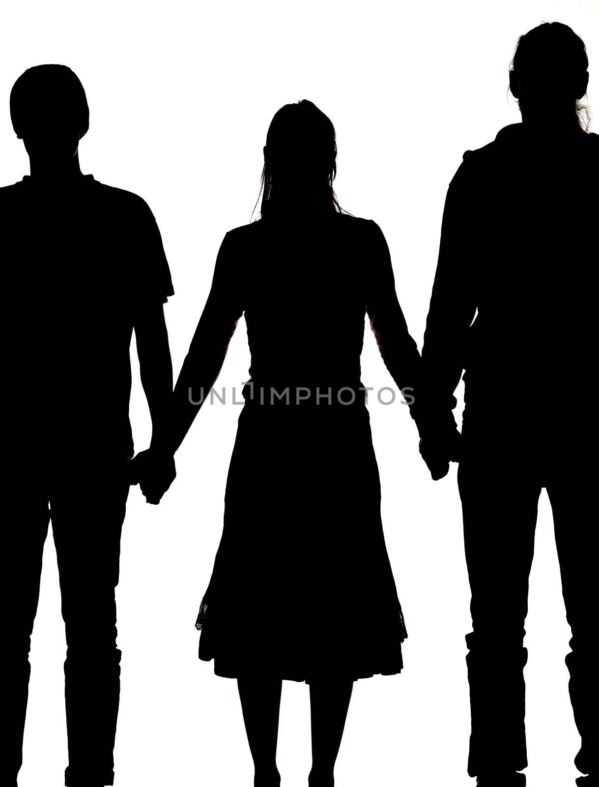 silhouette of a woman and two men holding hands