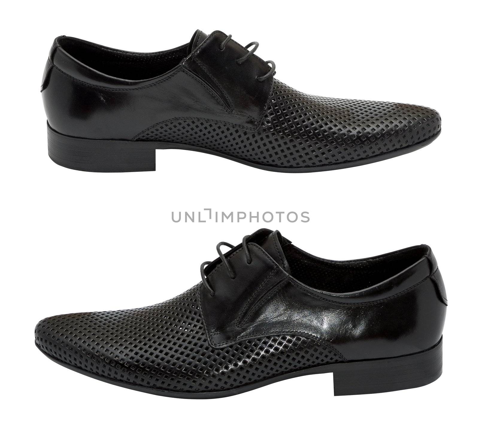 Pair of black leather summer shoes with holes for better ventilation