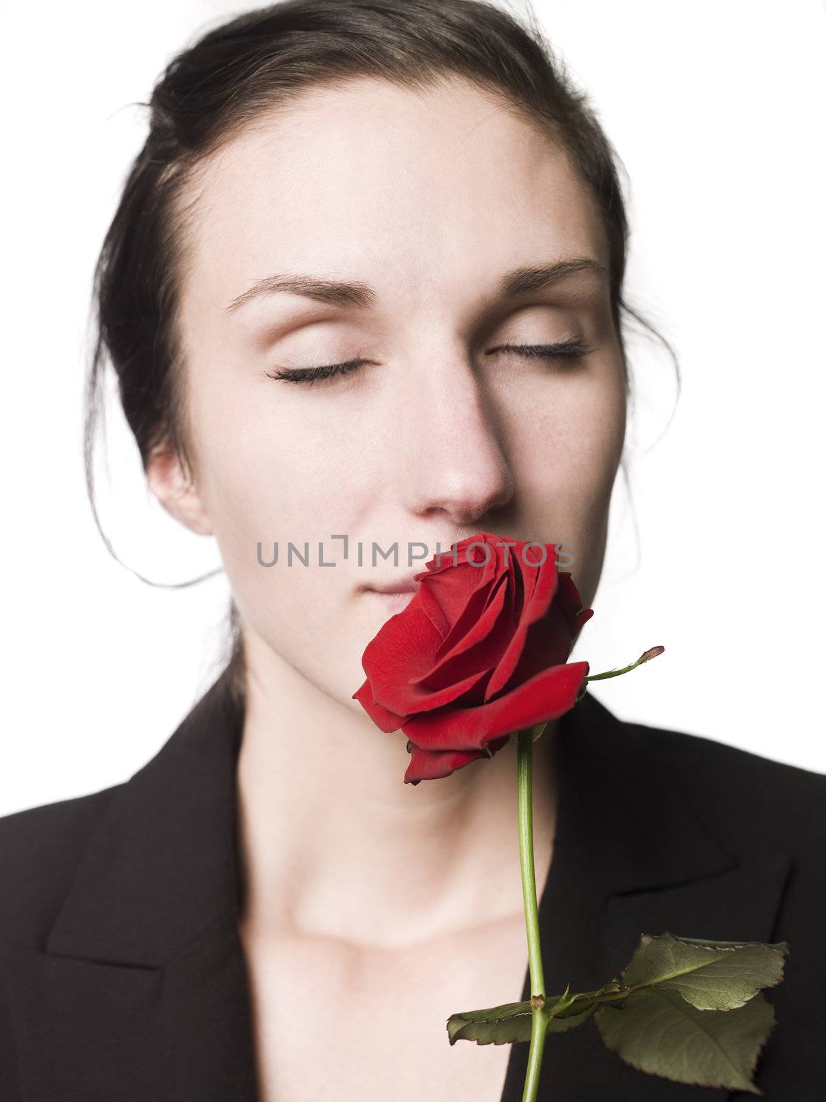 Woman smells a rose