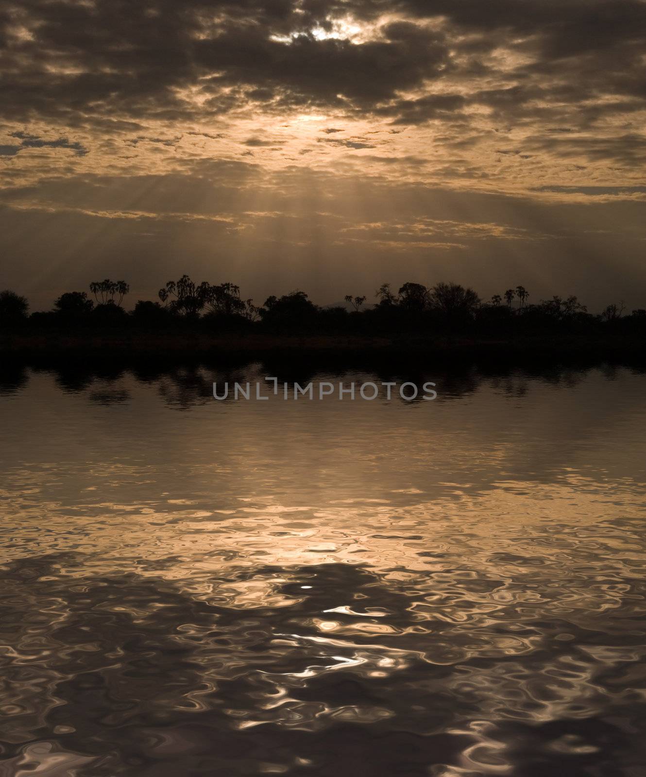 Morning sun rays through clouds in Samburu Reserve, Kenya