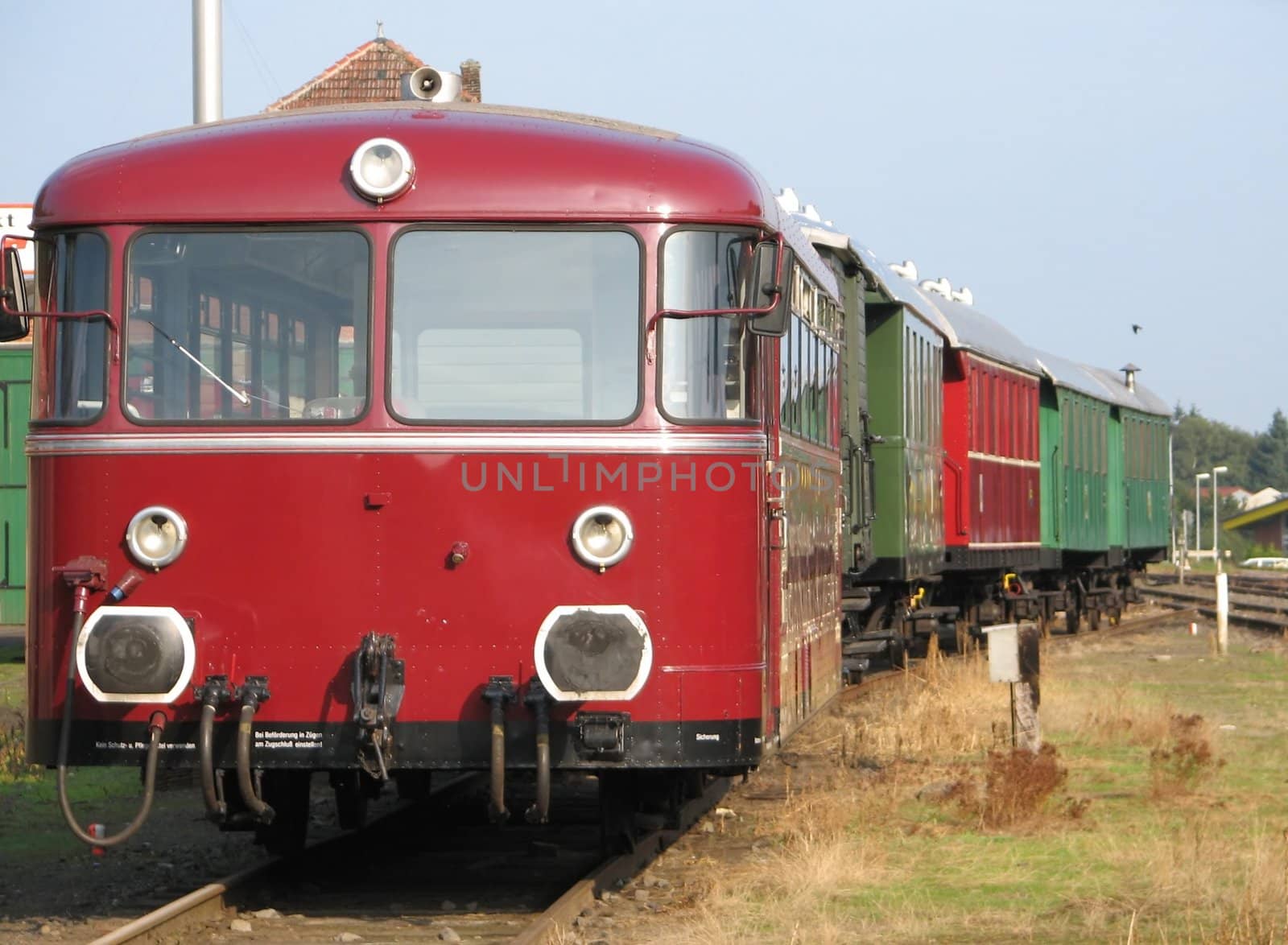 red and green vintage train with diesel locomotive