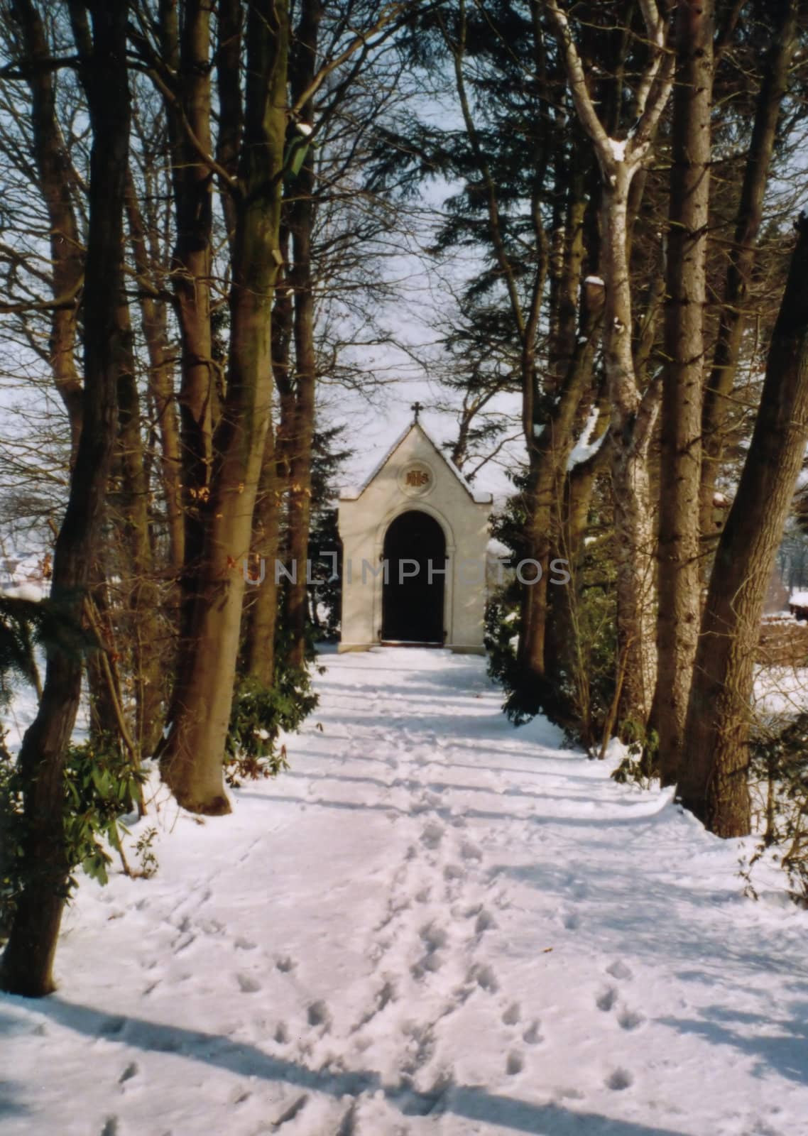 Chapel at the end of a snowy path