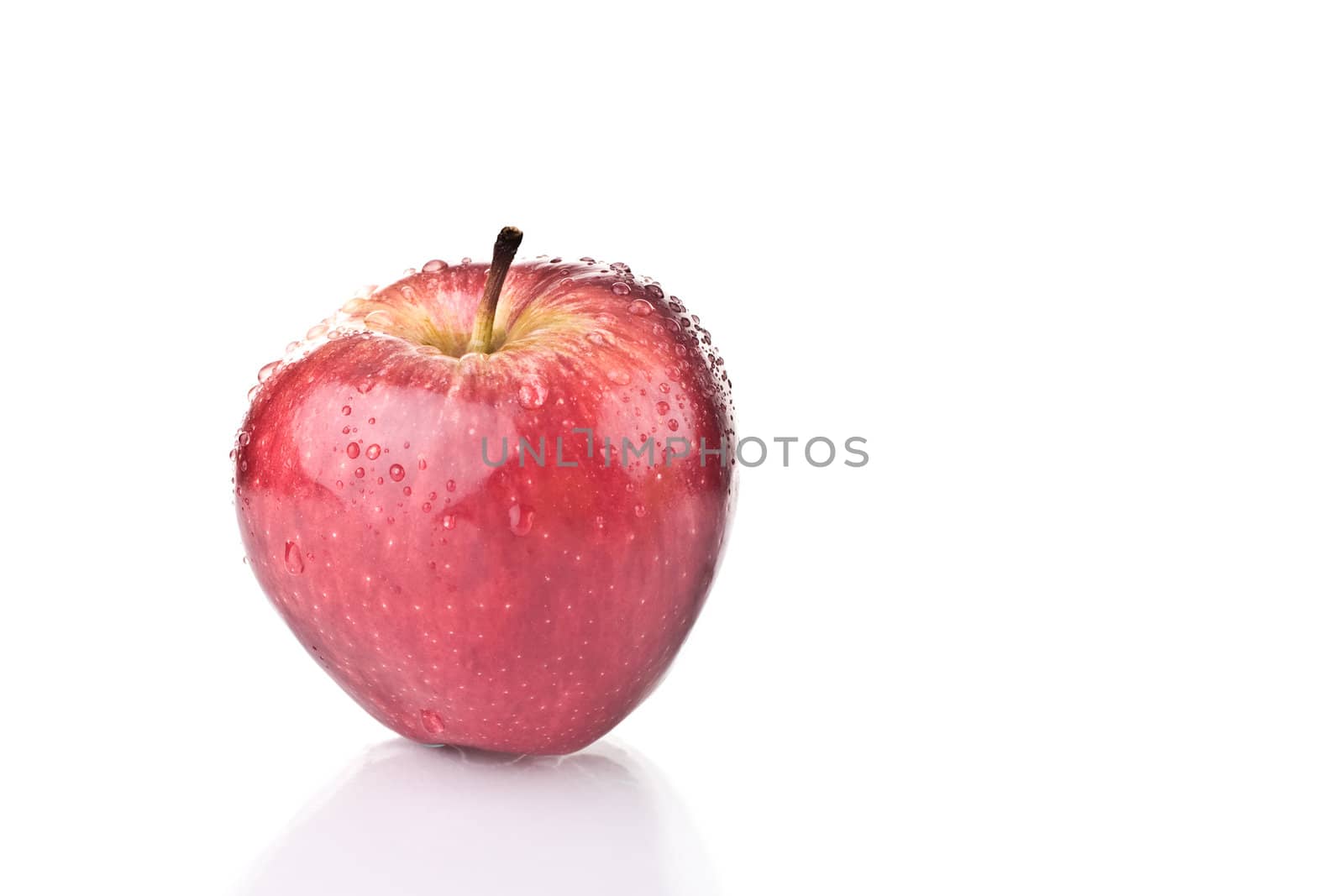 Fresh red apple over white background.