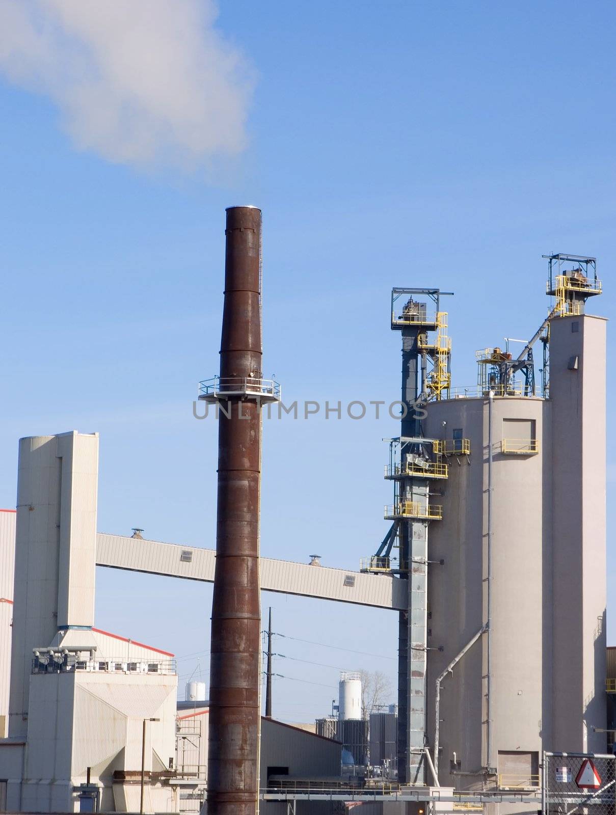 Industrial plant with smoke coming from the smokestack