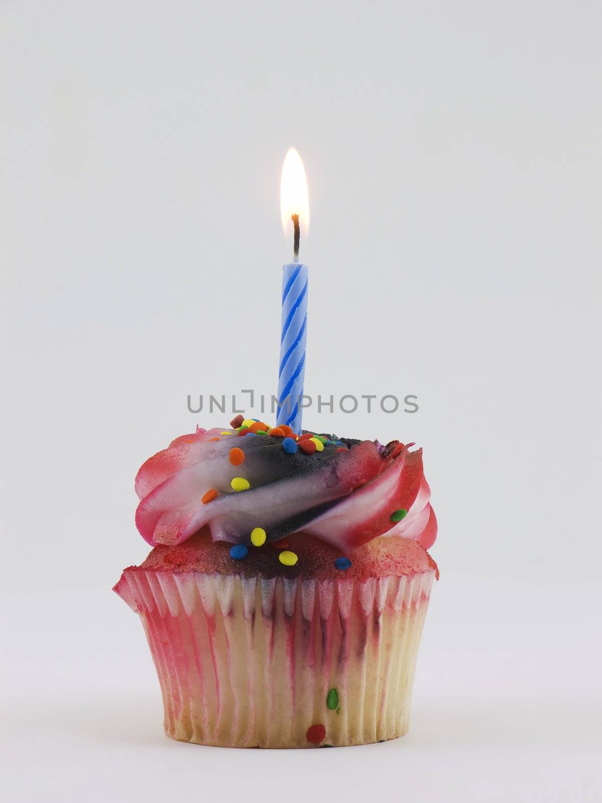 Cupcake with a lit candle in it