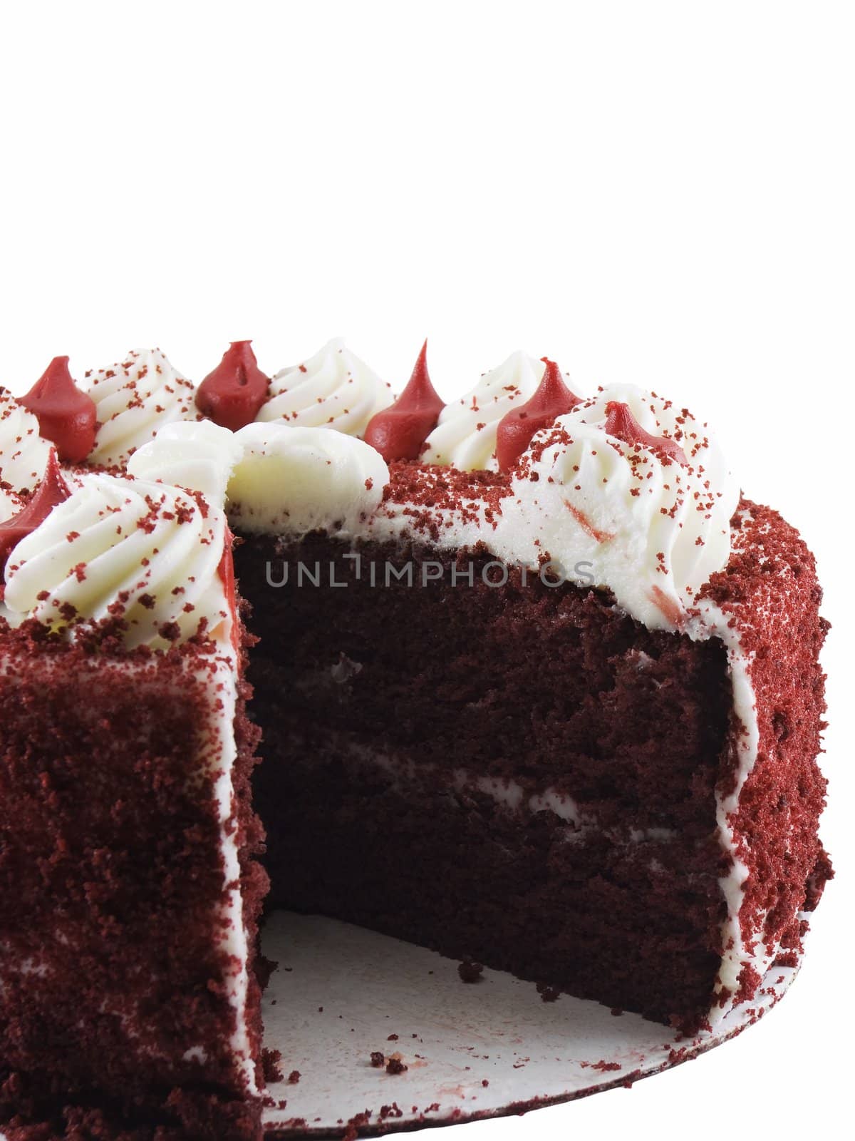 Red velvet cake with a slice missing isolated on a white background