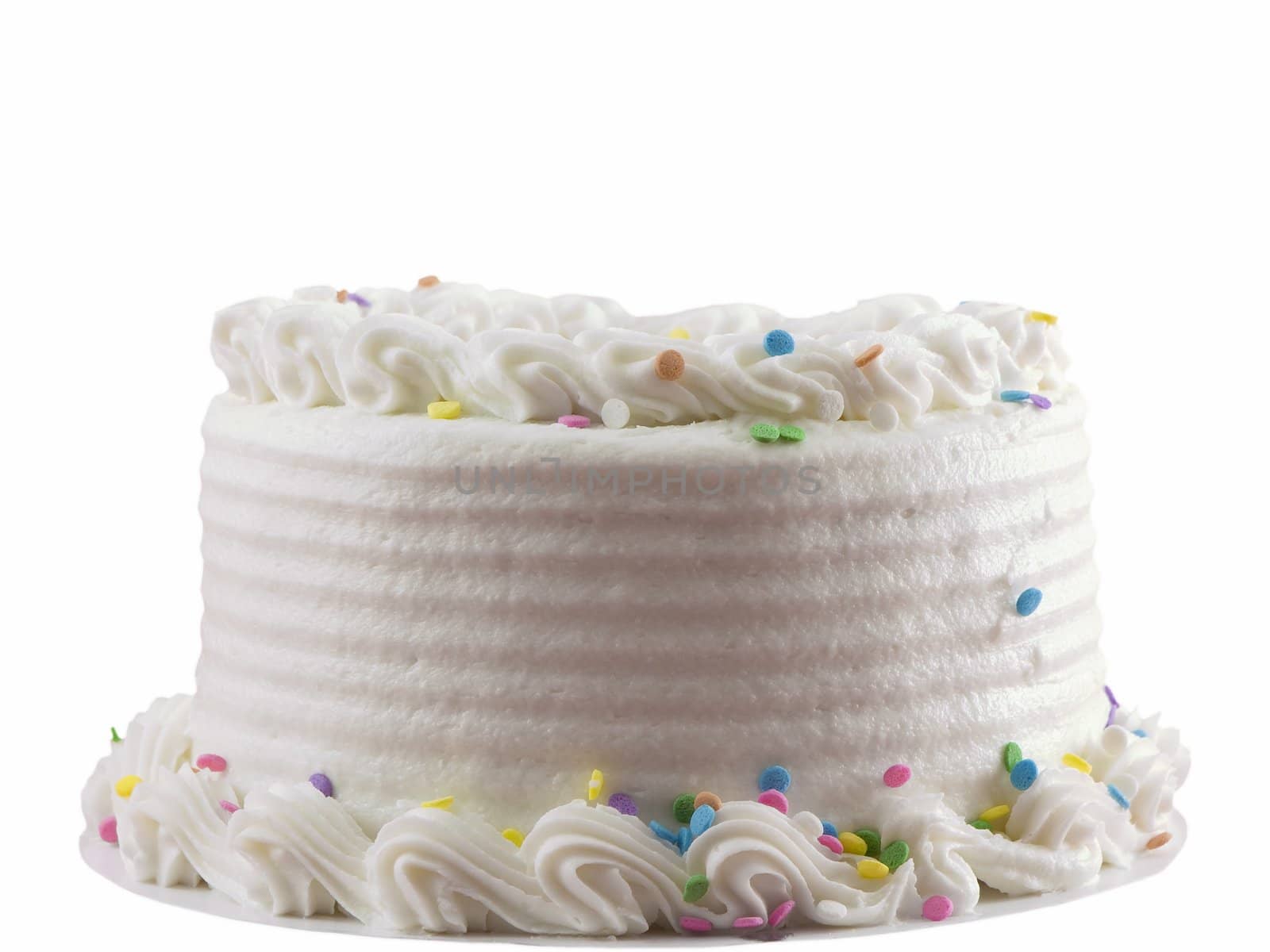 White frosted birthday cake isolated on white