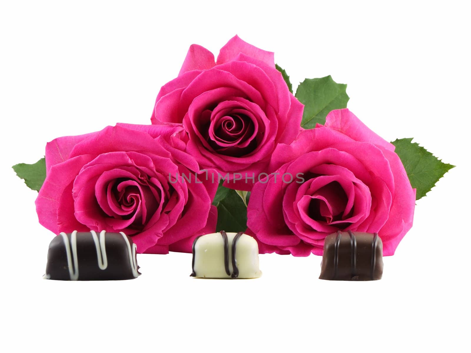 Three roses and chocolates isolated on white