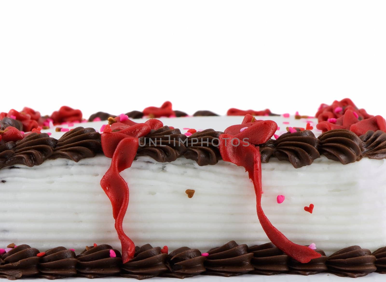 Side view of a frosted sheet cake isolated on white