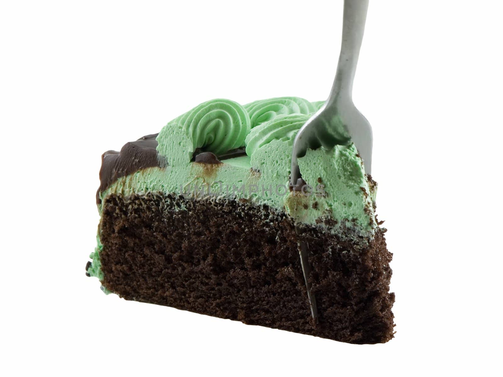 Fork in a slice of chocolate mint cake