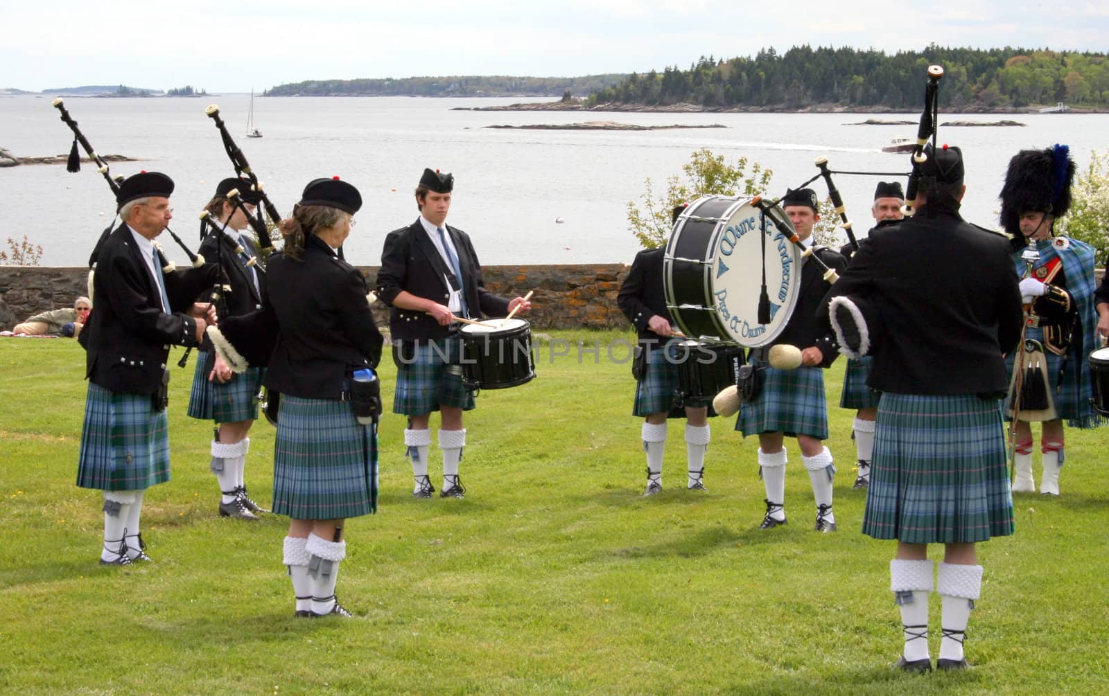 Along the coastline, the Maine St. Andrews Pipes and Drums bagpipers perform an exhibittion