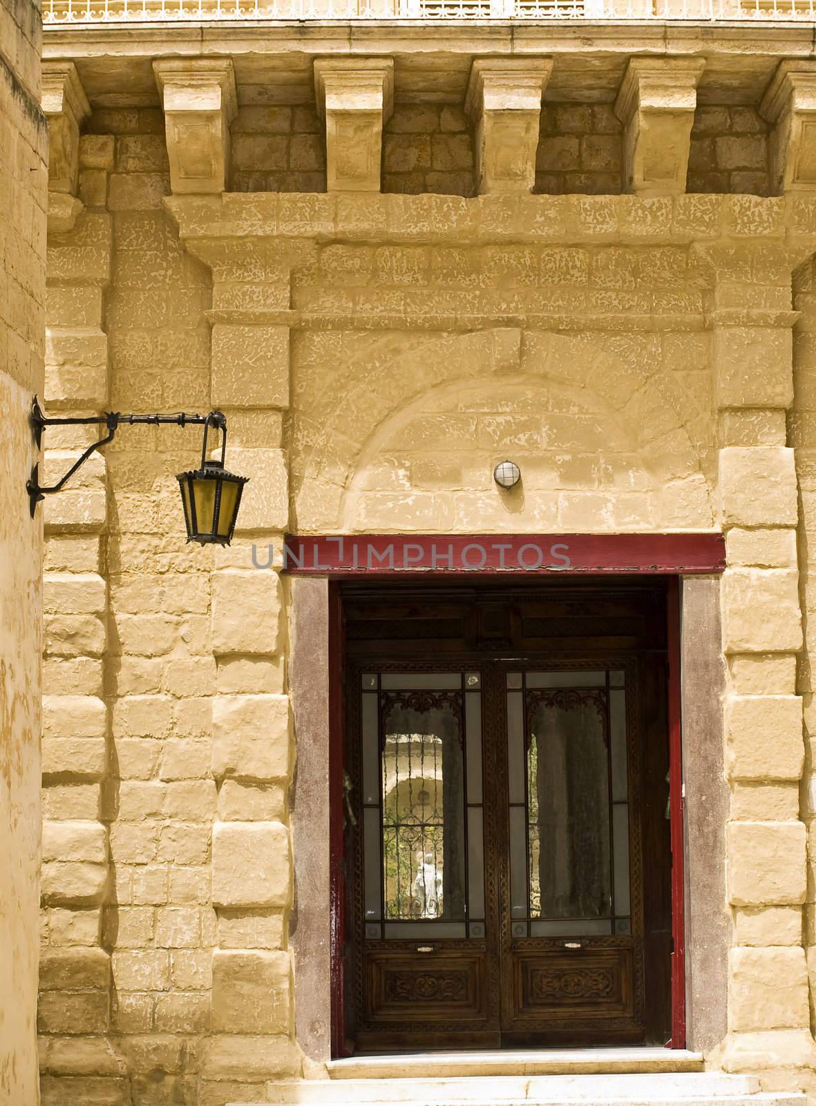 A medieval limestone facade in traditional baroque style in Mdina on the island of Malta