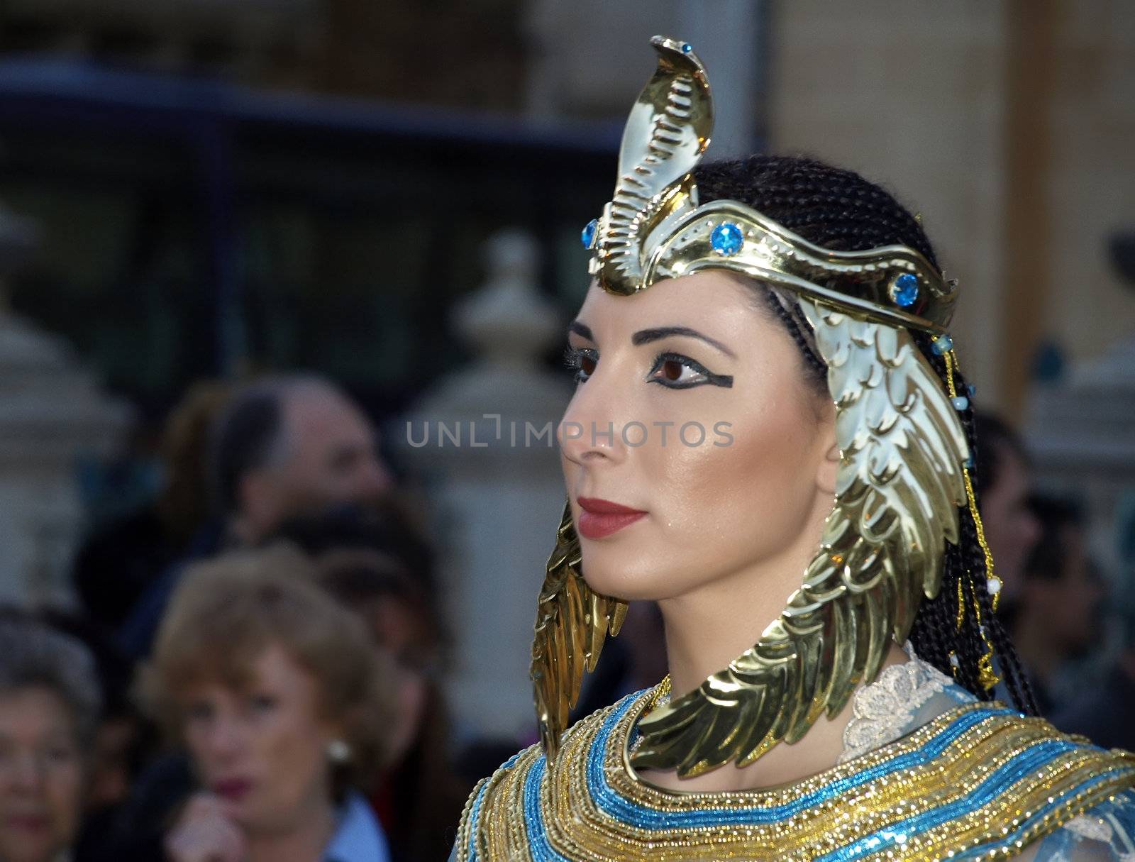 Woman dressed up as Queen Cleopatra during reenactment of Biblical times  