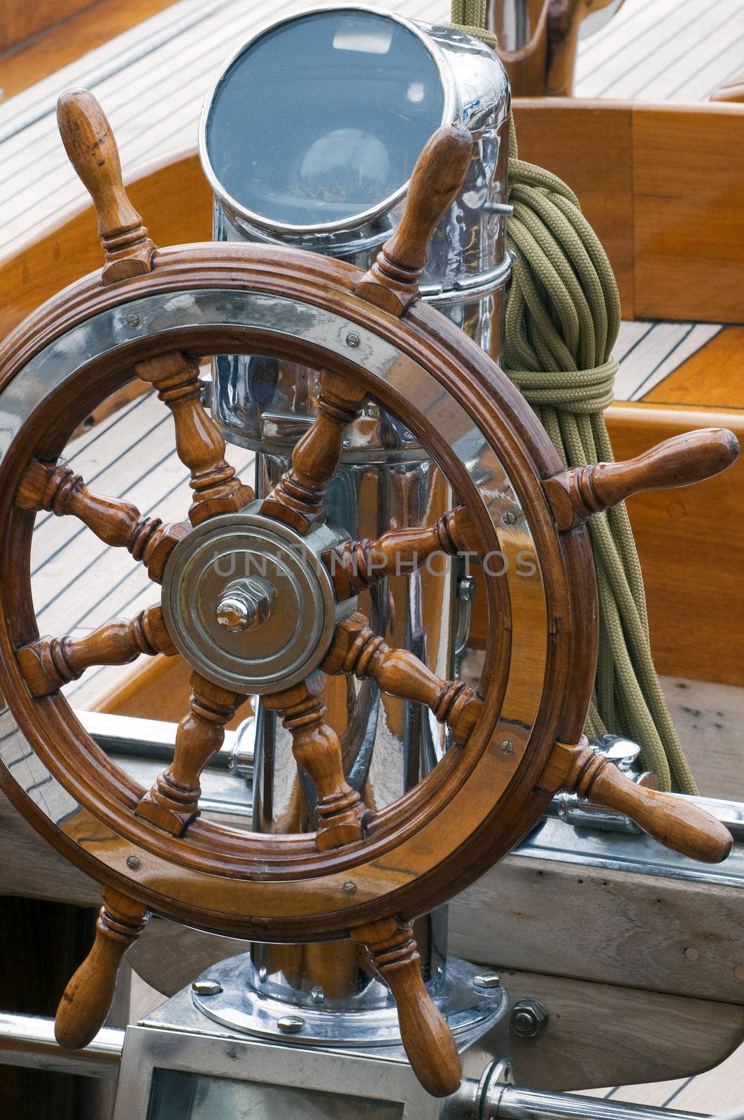 Detail of a wooden steering wheel on a classical sailboat