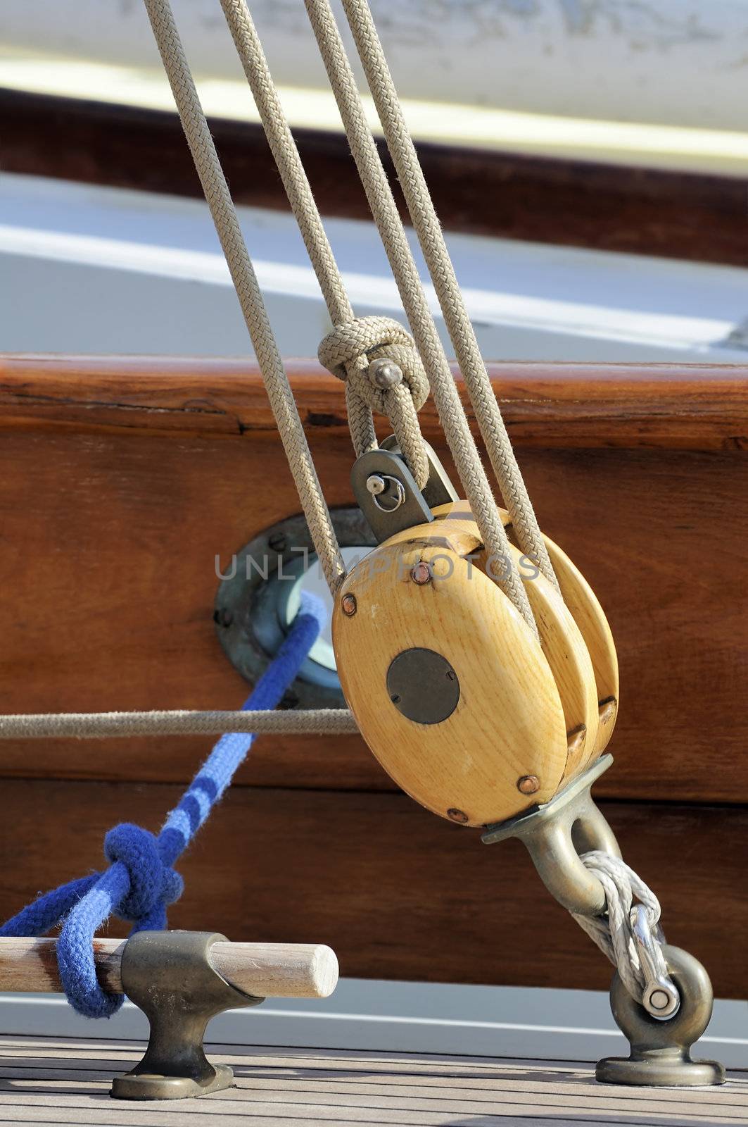 Detail of ropes and pulleys of a wooden sailboat