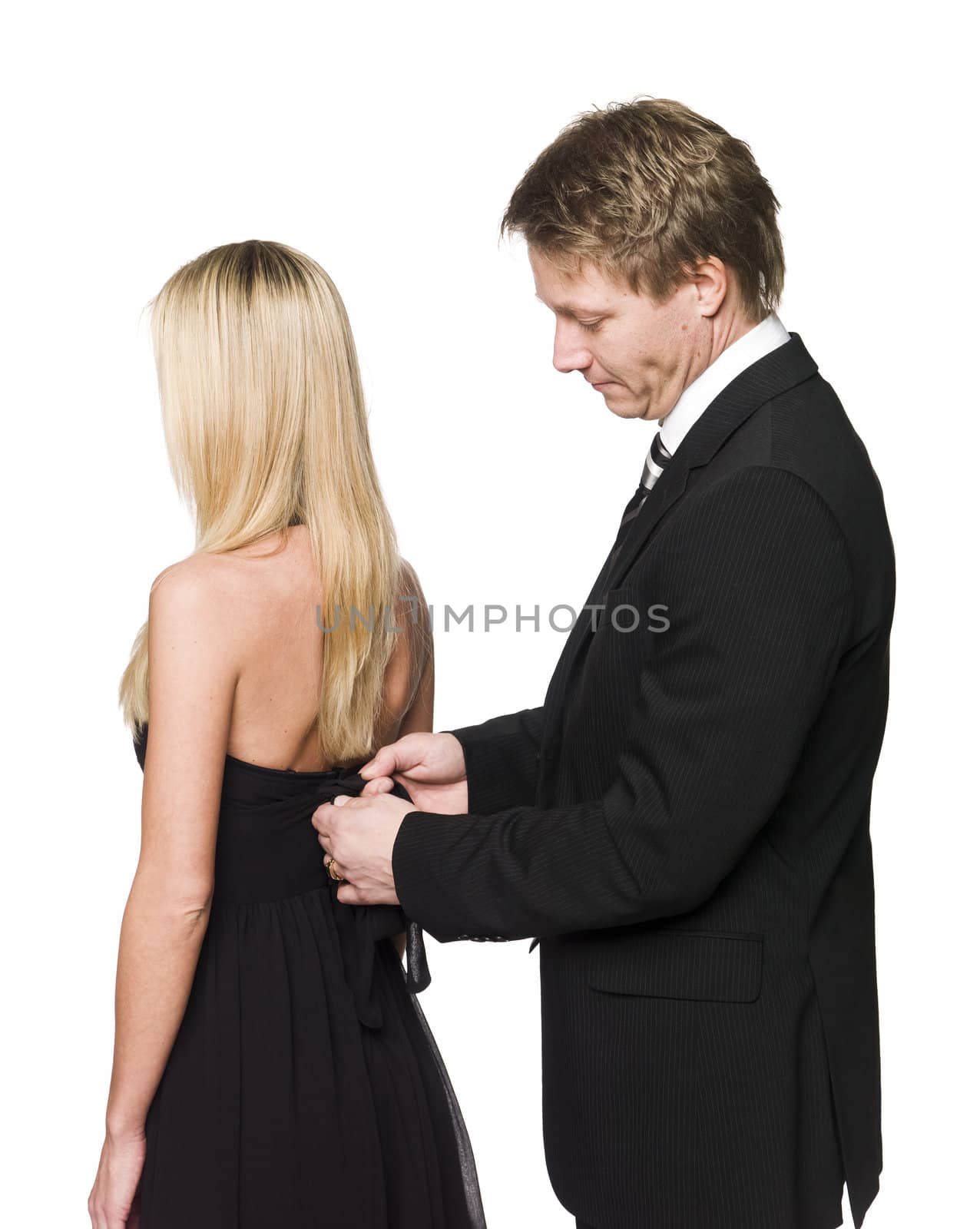 man helping woman to get dressed