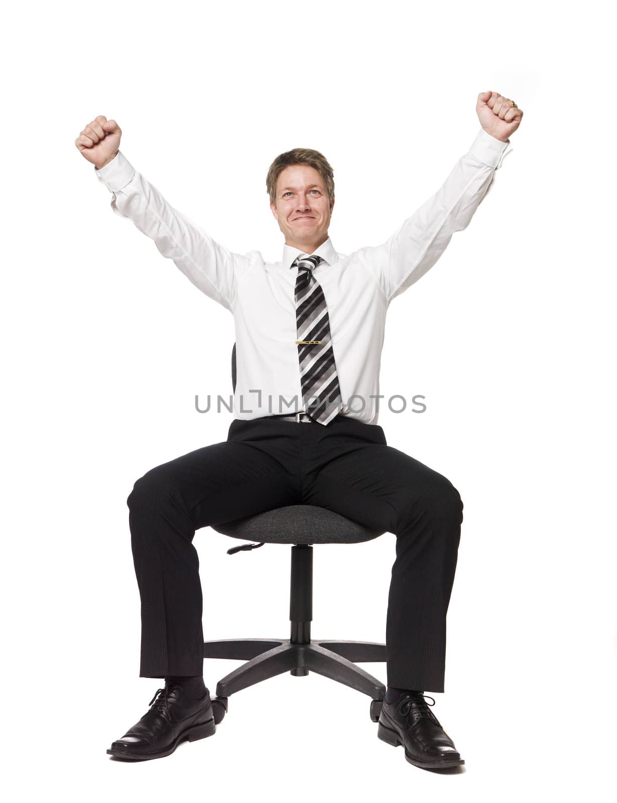 Happy man siting on a office chair by gemenacom