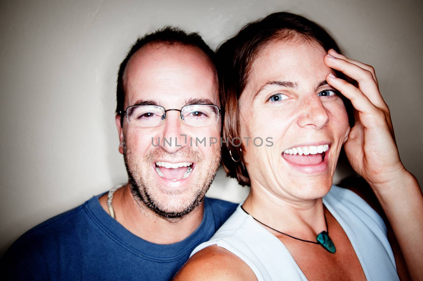 Close up shot of attractive couple laughing