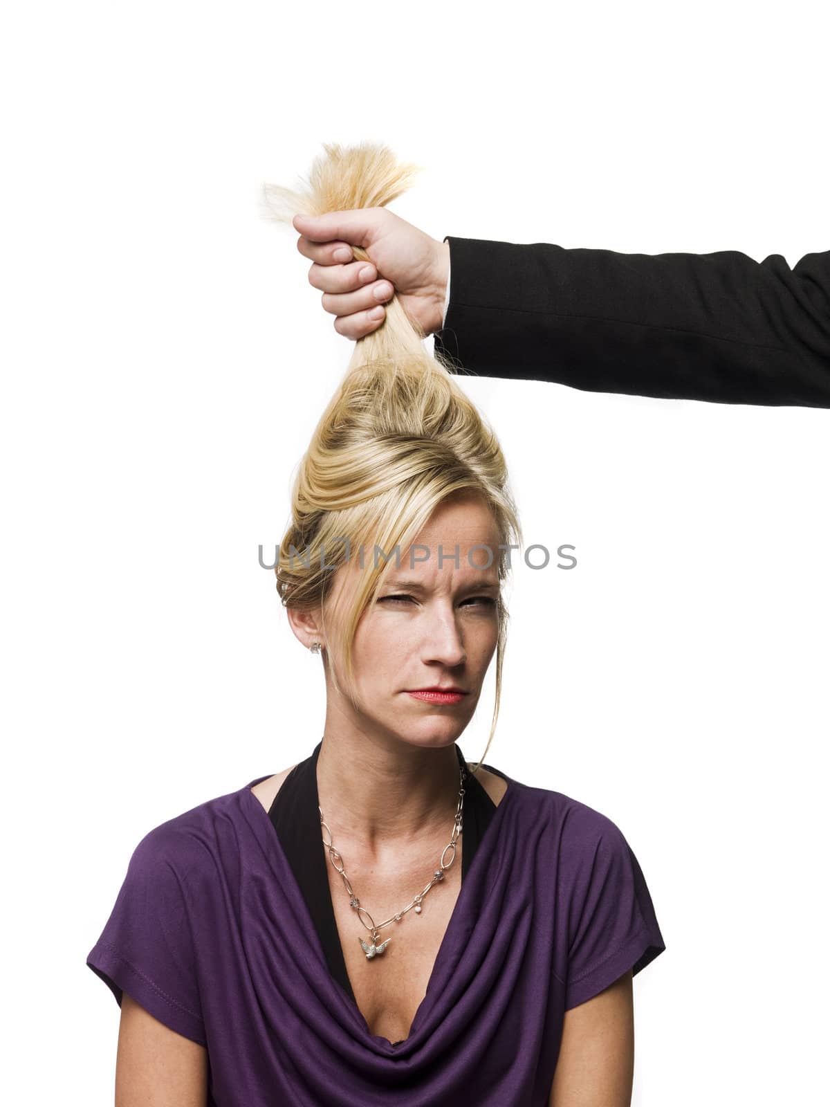 man pulling a woman in the hair