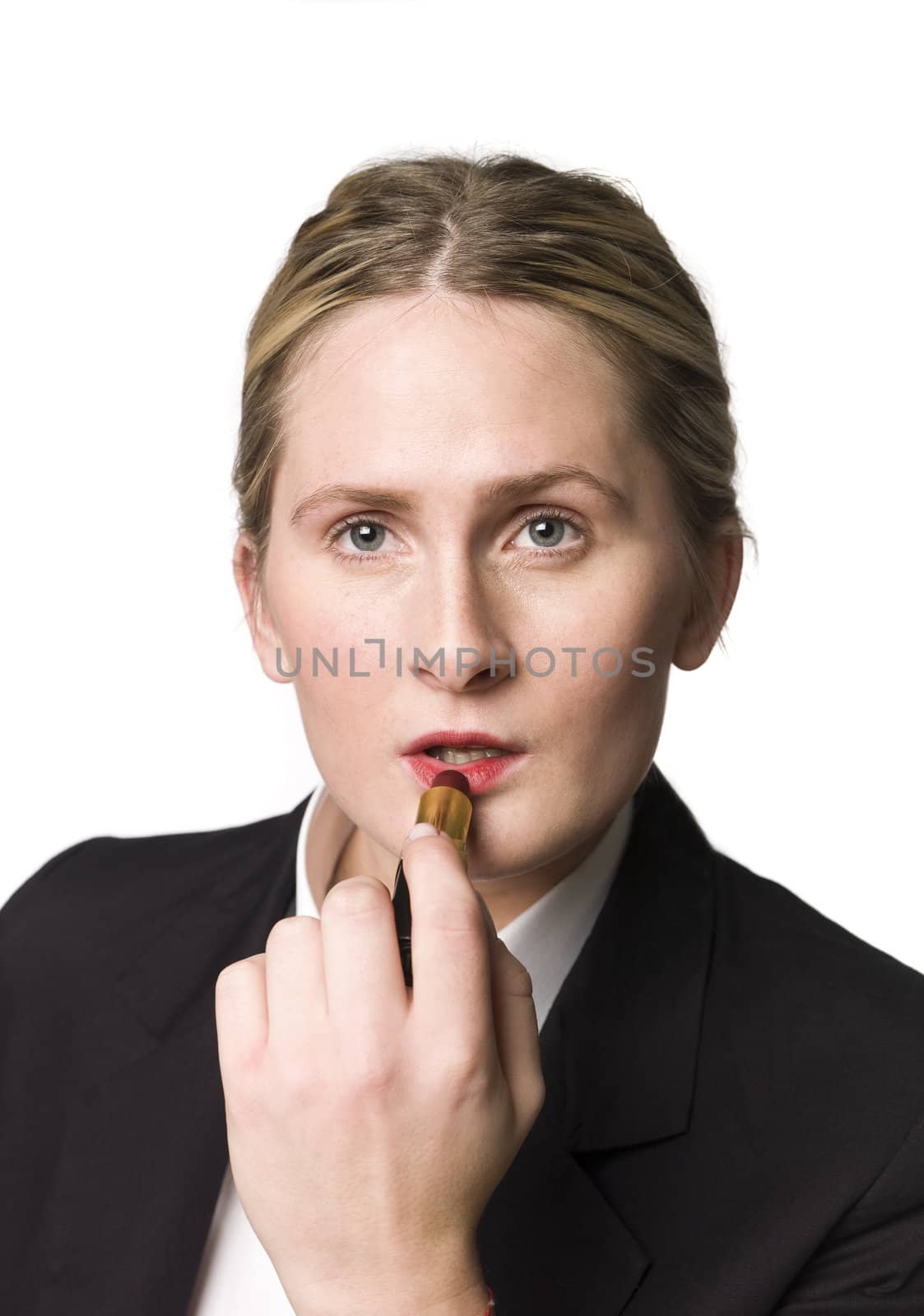 Portrait of a woman puting on makeup