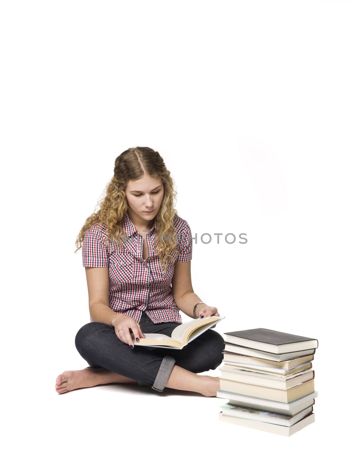 Woman siting on the floor reading