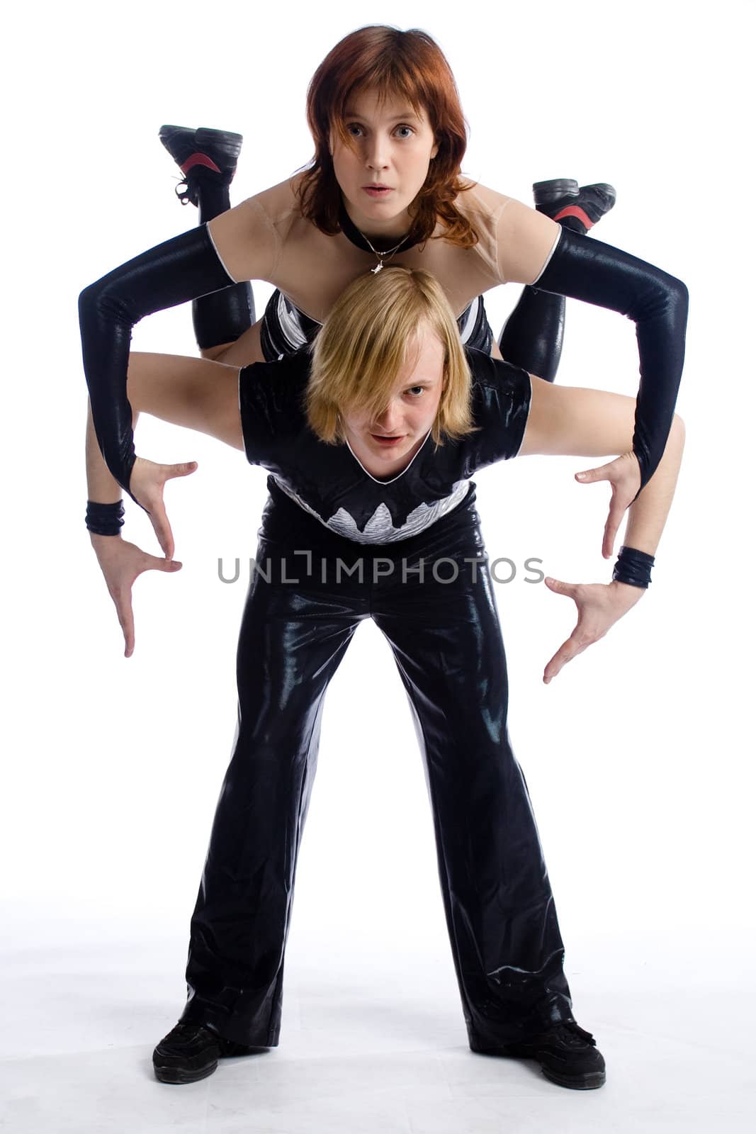 two dancers in same costumes on white
