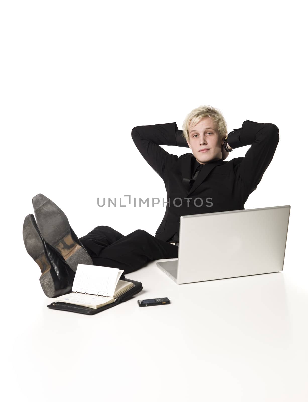 Relaxed boy infront of a desk