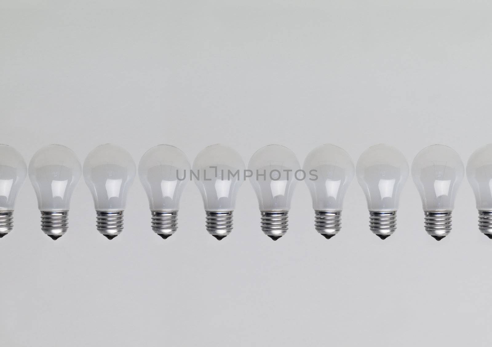 Row of light bulbs by gemenacom