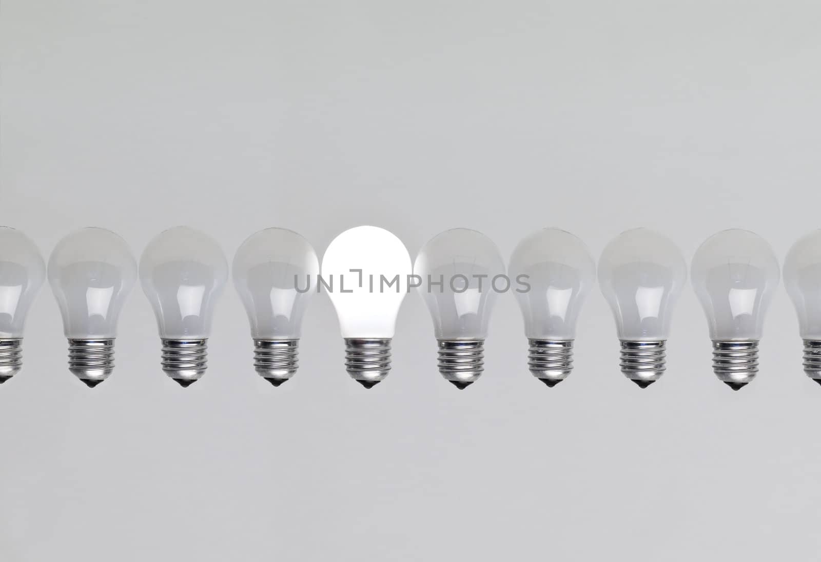 Row of light bulbs by gemenacom