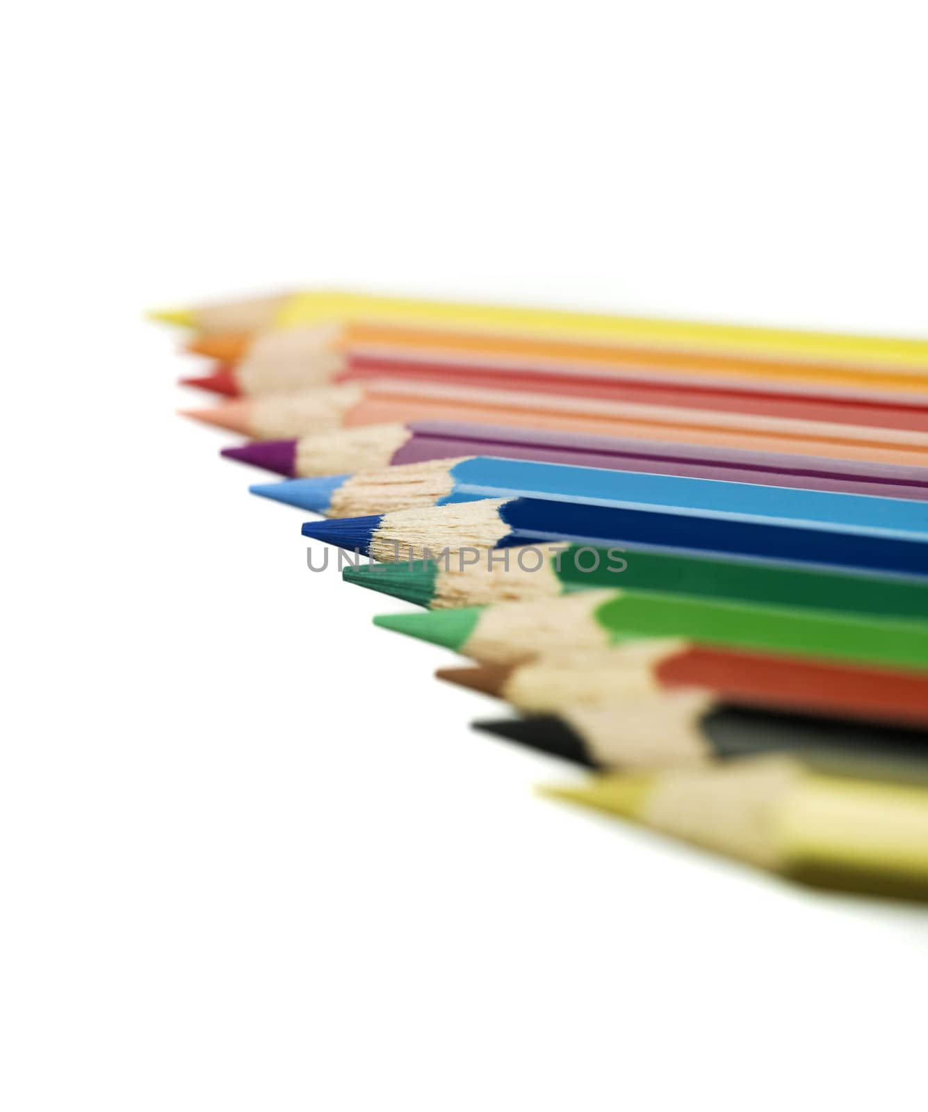 Row of colored pencils by gemenacom