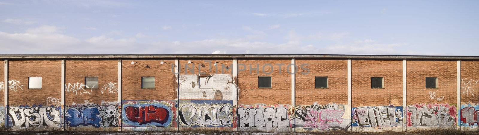 Brickwall with graffiti on