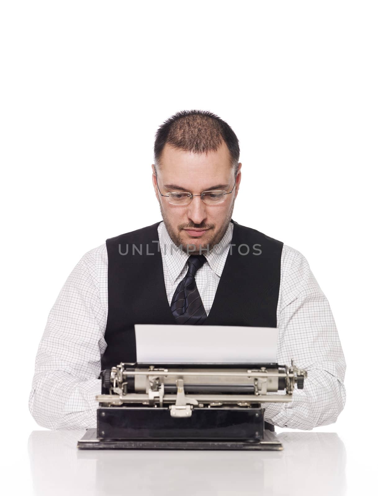 Man writing on a vintage typewriter by gemenacom