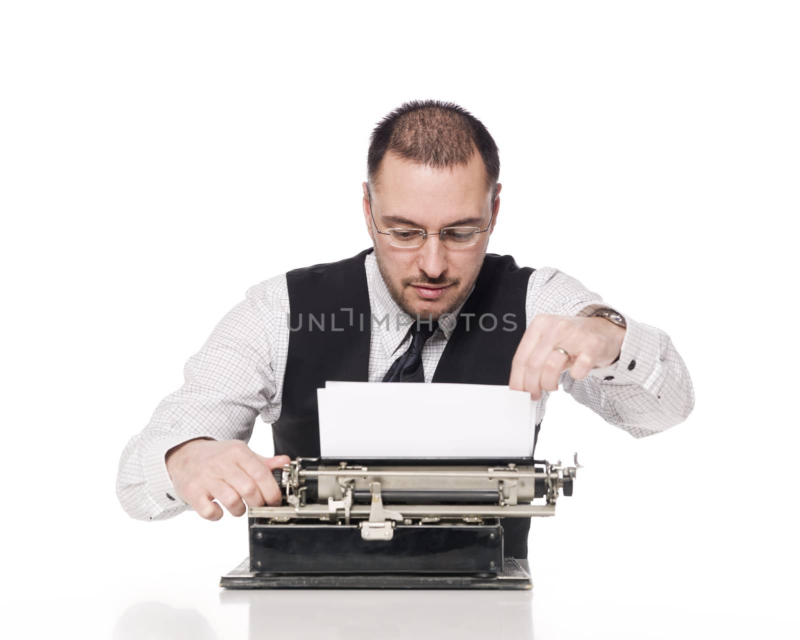 Man writing on a vintage typewriter by gemenacom
