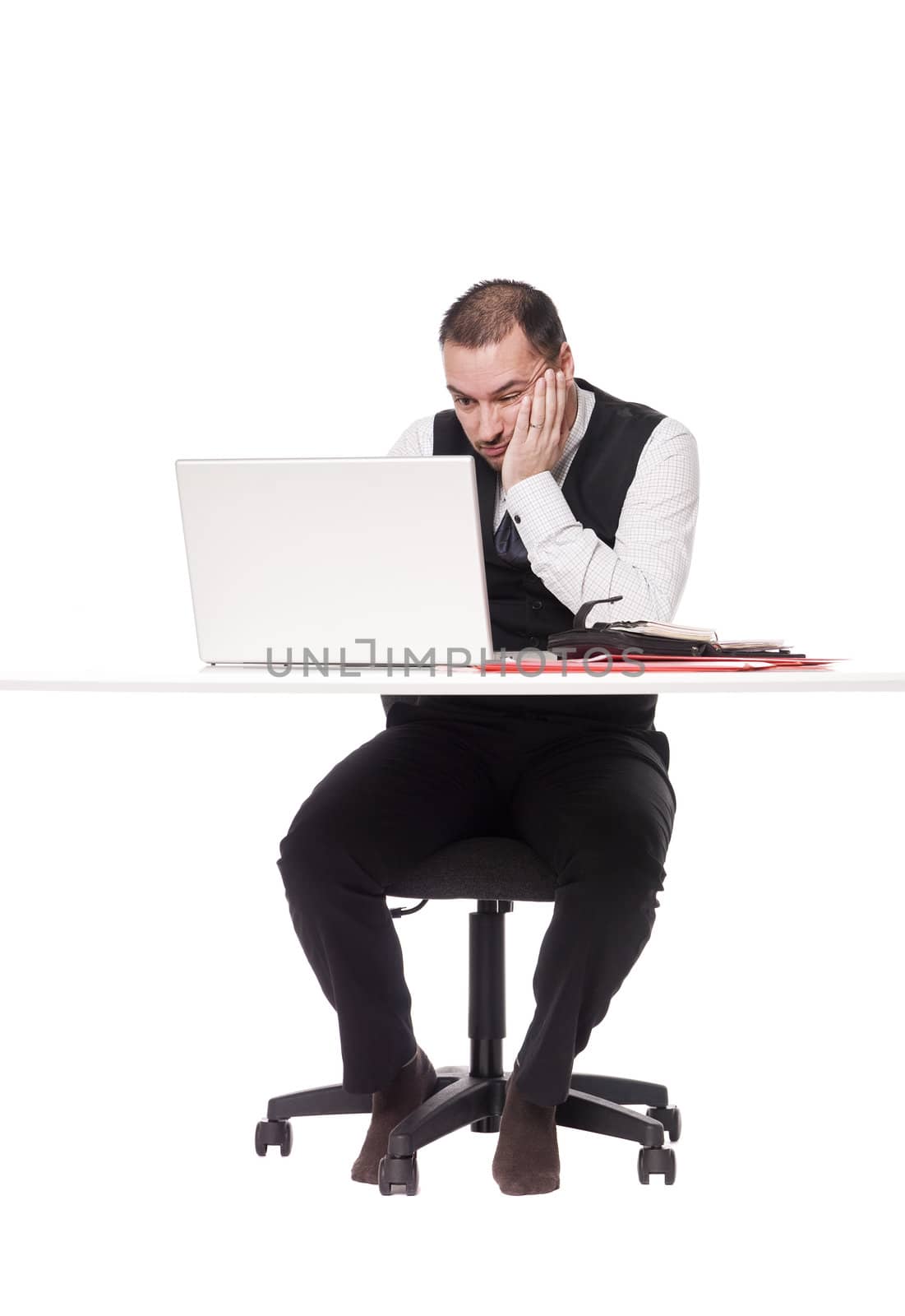 Tired man behind a desk