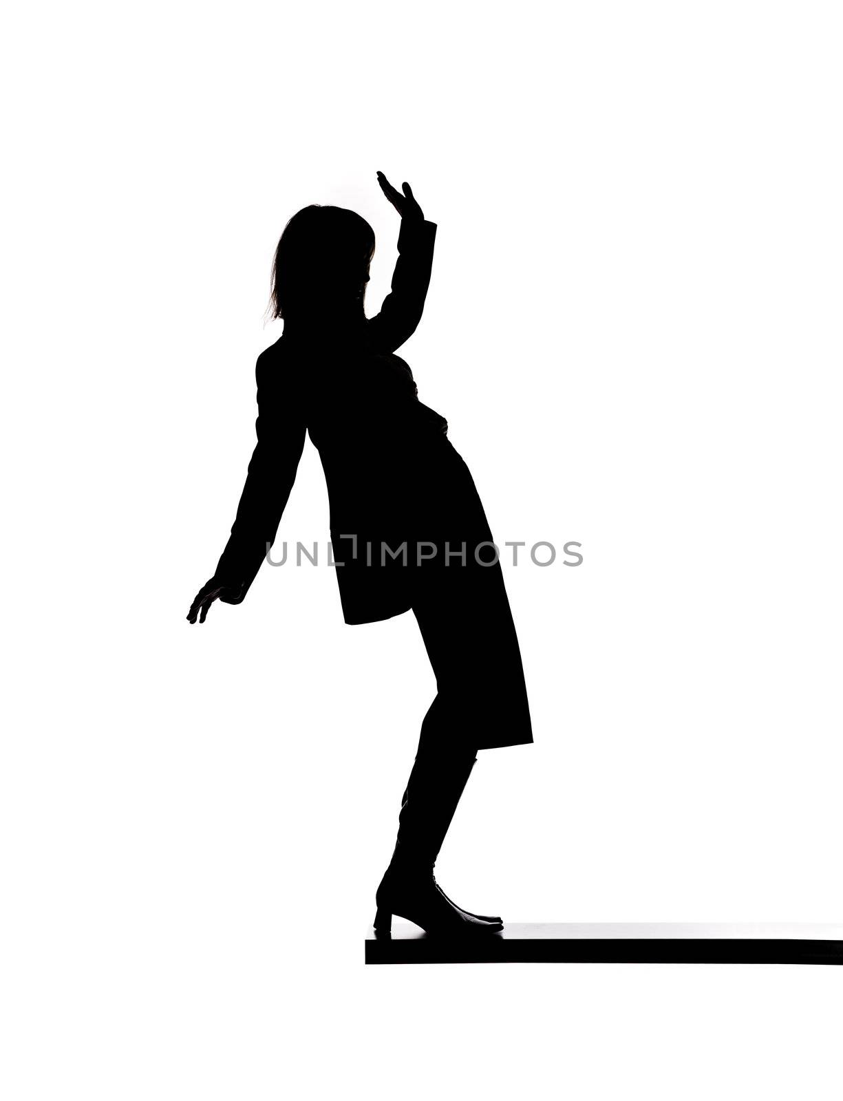 Silhouette of a woman close to fall down by gemenacom