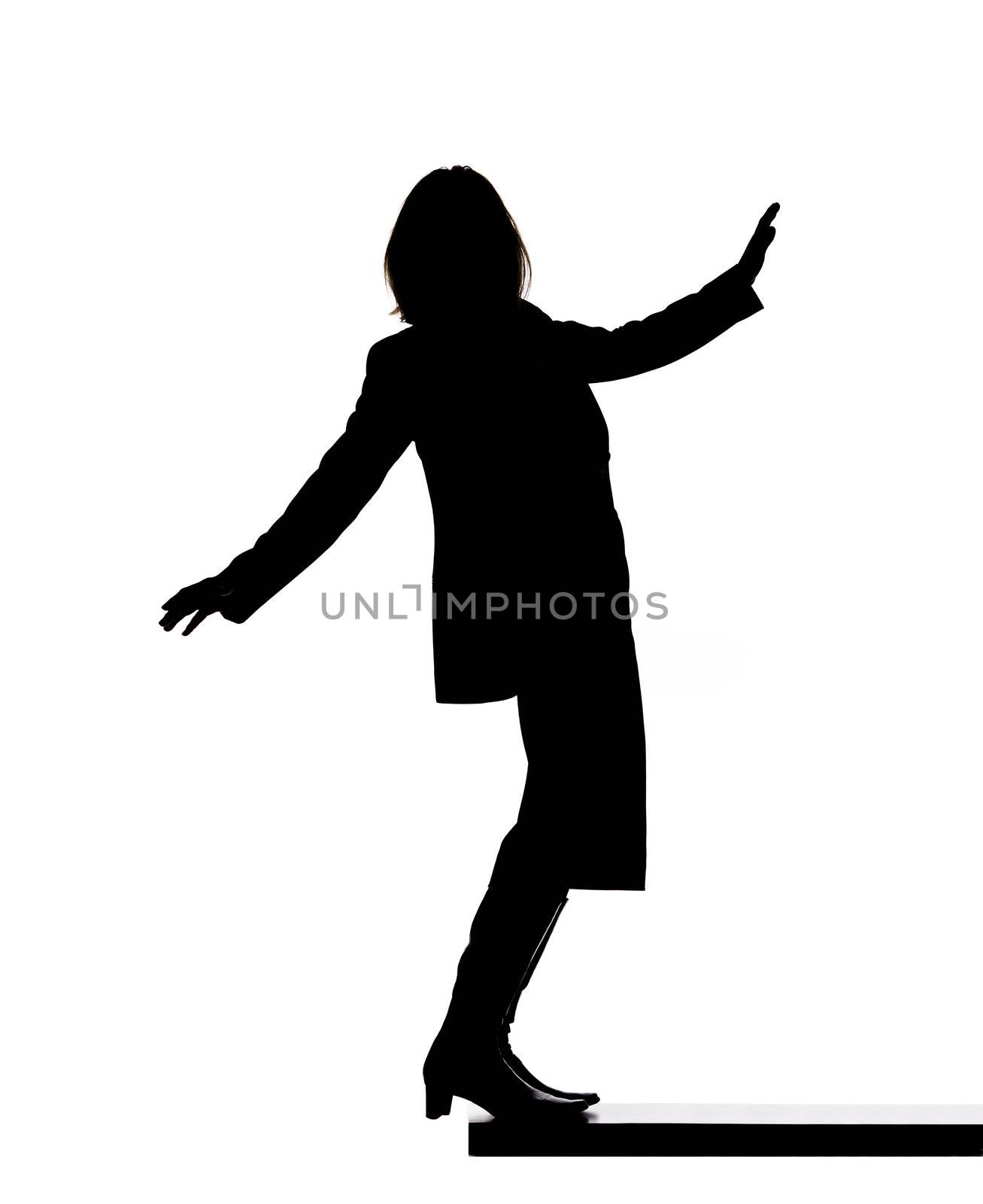 Silhouette of a woman looking down
