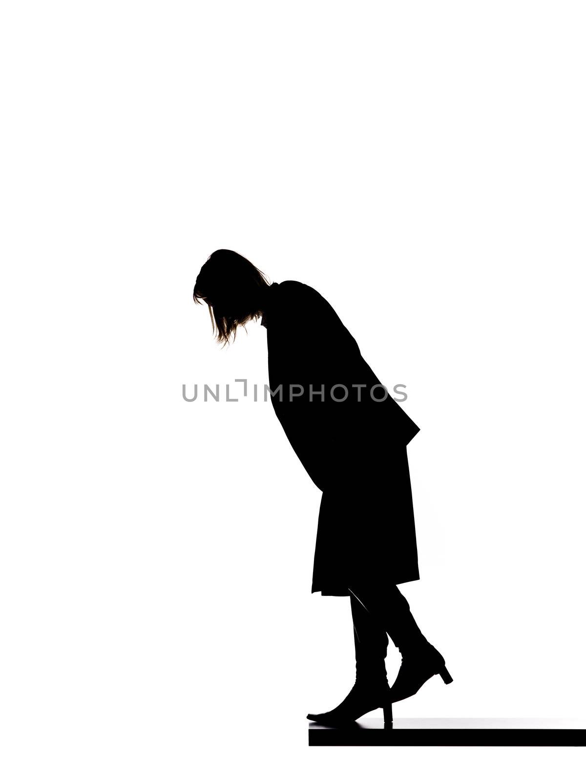Silhouette of a woman looking down by gemenacom