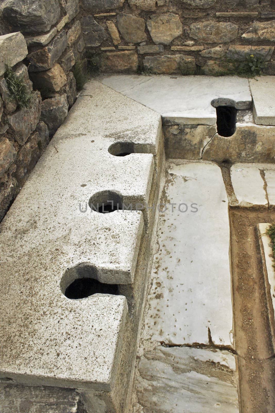 Roman public toilet. Turkey, Ephesus. Sumer time.