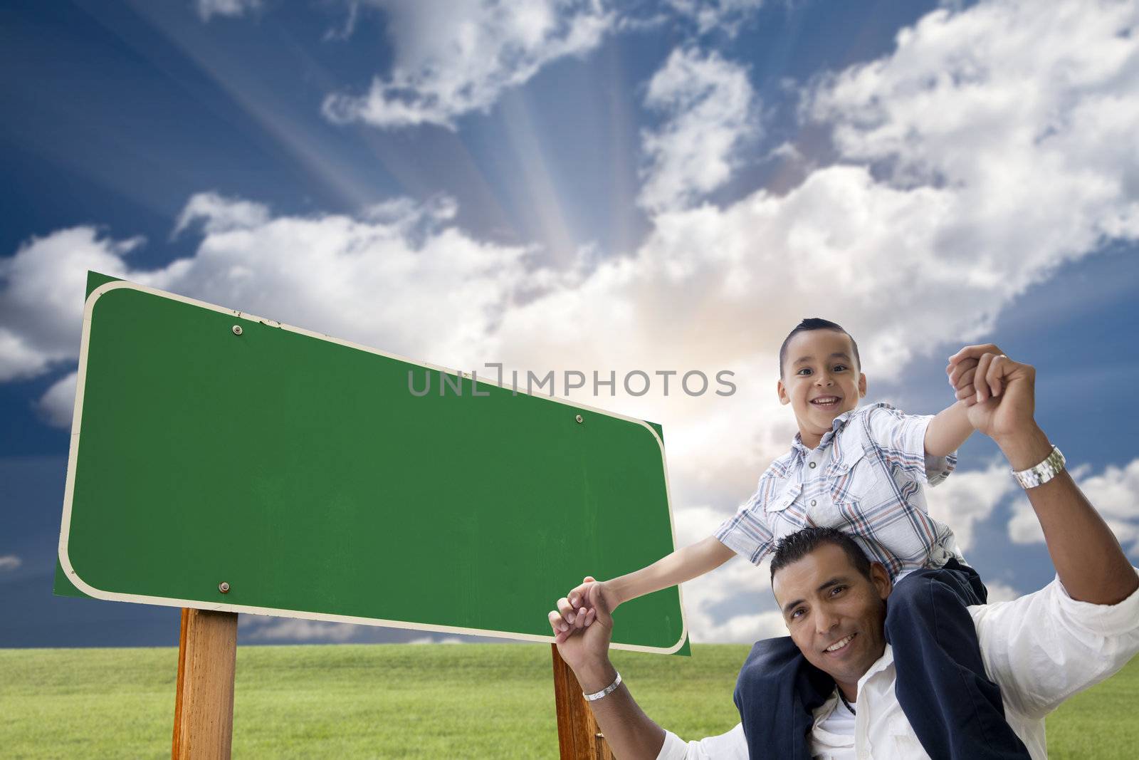 Father and Son in Front of Blank Green Road Sign by Feverpitched