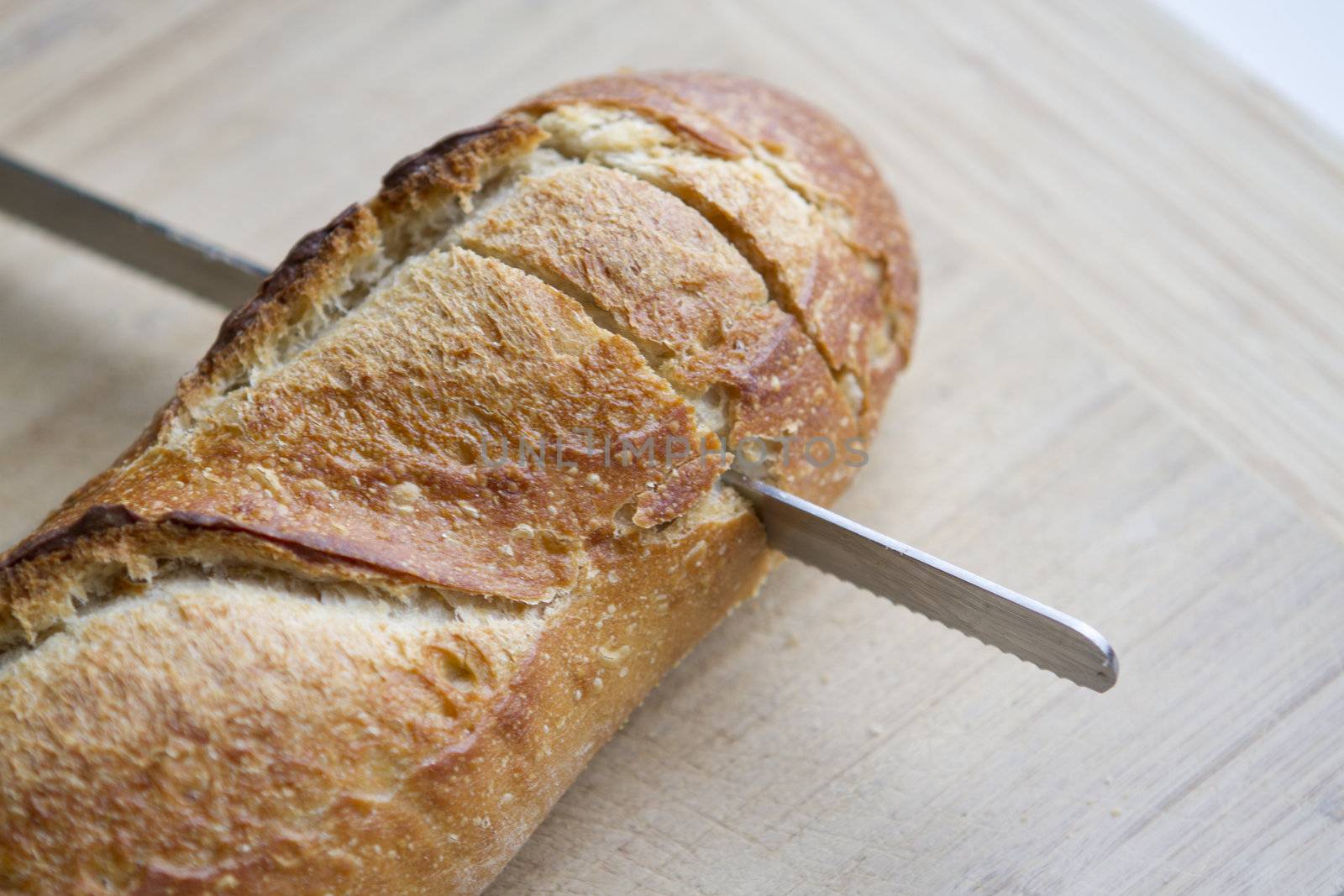 Cut in half Italian Bread. Shallow Depth of field on the cutting board.