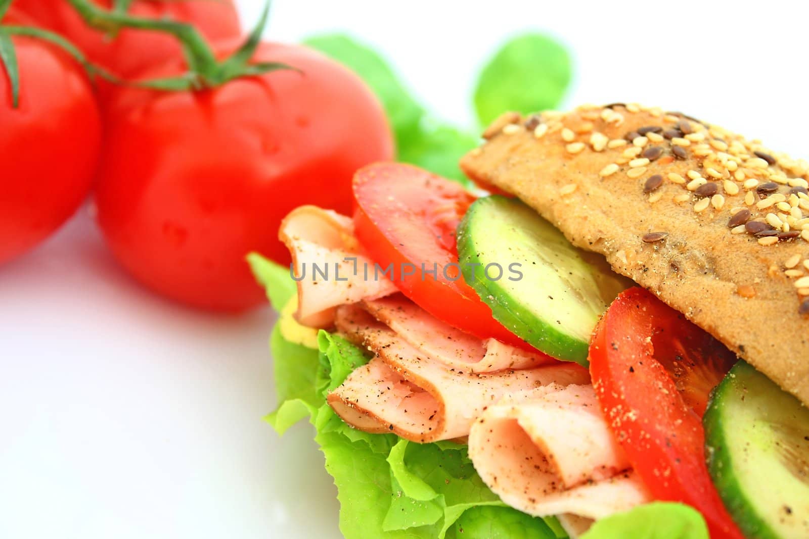 Fresh sandwich with ham and cheese and vegetables