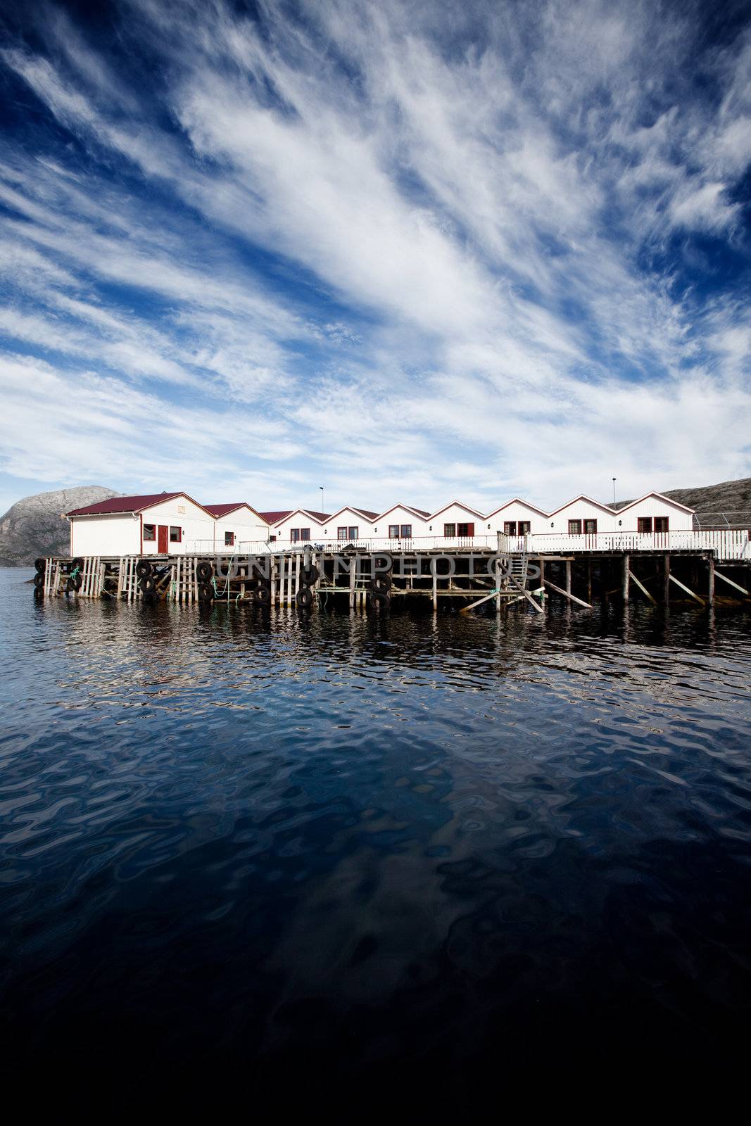 A group of small cabins on the coast of Norway